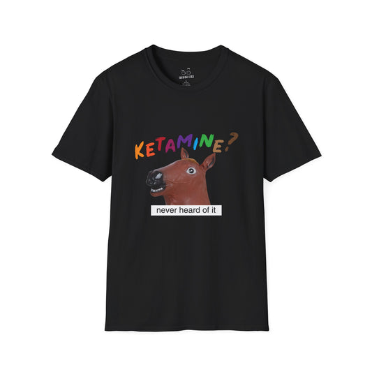 T-shirt featuring a derpy horse head mask mid-neigh, wide-eyed, “Ketamine?” in colorful handwritten letters above, and “never heard of it” on a black rectangle on its neck.