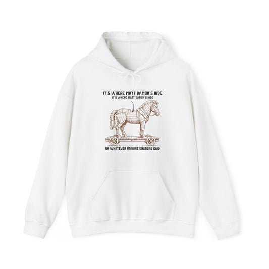 Hoodie with an illustrated Trojan horse on a wooden wheeled platform with “It’s Where Matt Damon’s Hide” design odyssey imagine dragons parody