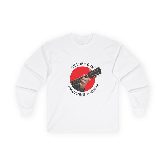 Funny t-shirt showing a hand fingering the A minor guitar chord with the phrase “Certified in Fingering A Minor,” cheeky pun for musicians.