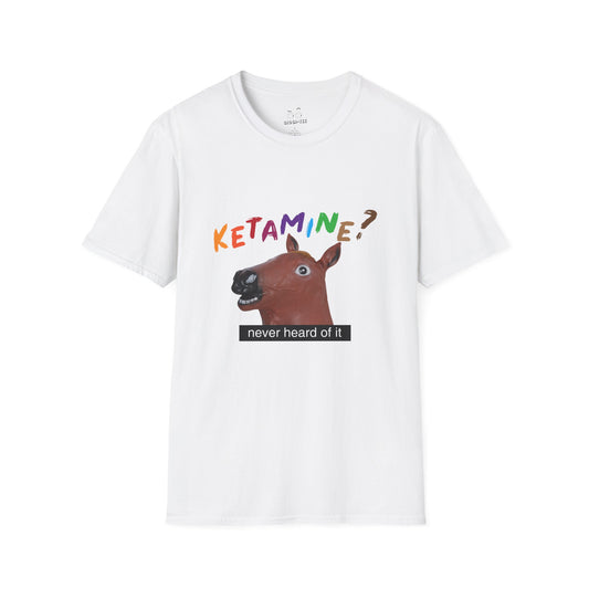 T-shirt featuring a derpy horse head mask mid-neigh, wide-eyed, “Ketamine?” in colorful handwritten letters above, and “never heard of it” on a black rectangle on its neck.
