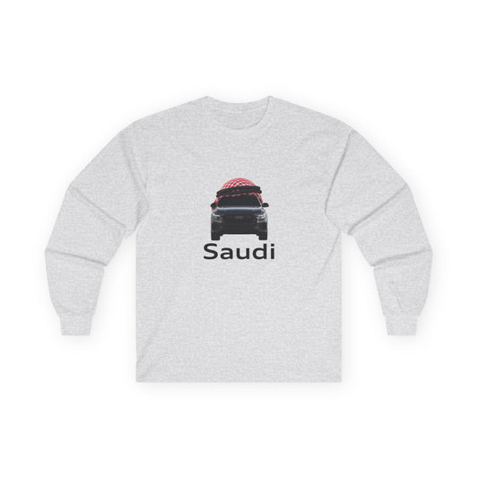 A t-shirt graphic featuring a front-facing Audi car wearing a red and white Saudi shamagh on its roof like a traditional headdress, styled in a modern streetwear aesthetic.