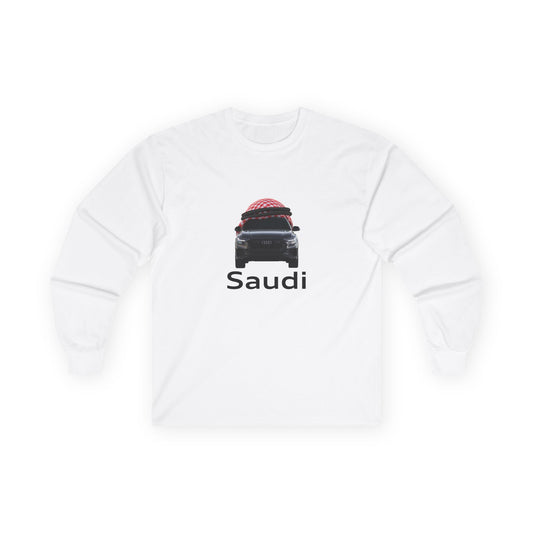A t-shirt graphic featuring a front-facing Audi car wearing a red and white Saudi shamagh on its roof like a traditional headdress, styled in a modern streetwear aesthetic.